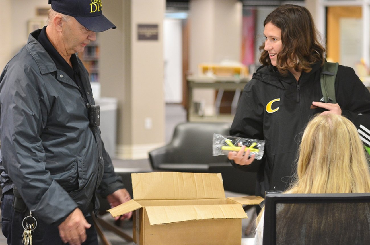 DPS officers handing out free gear on campus