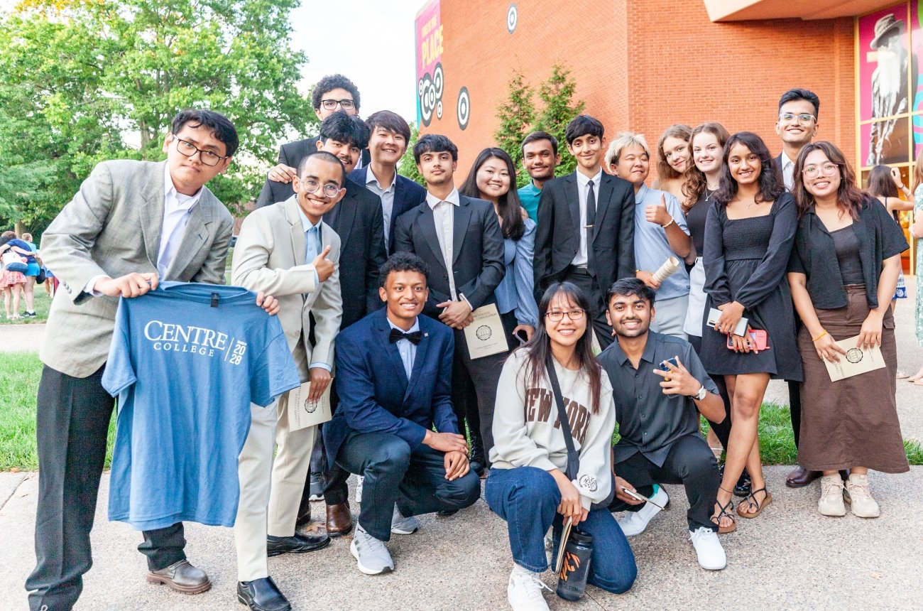 Large group of students smiling at the camera.