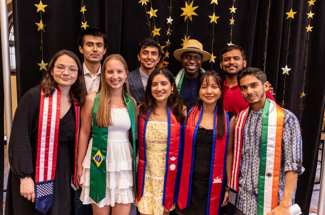 Group of students standing together smiling at camera
