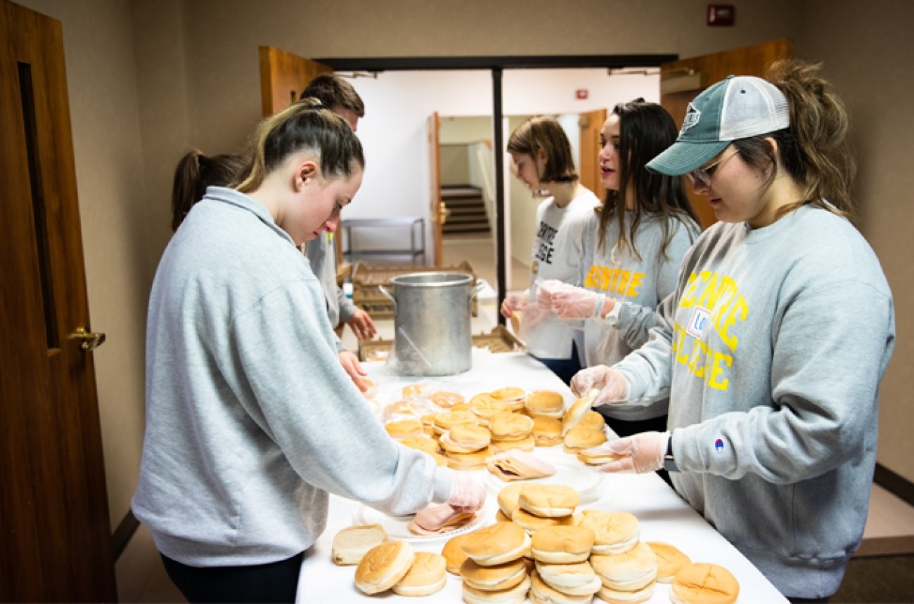 Students working at food pantry.