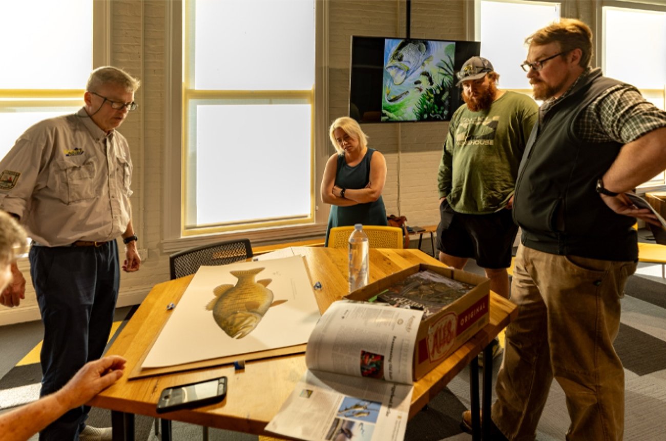 Professor and students and fish &amp; wildlife