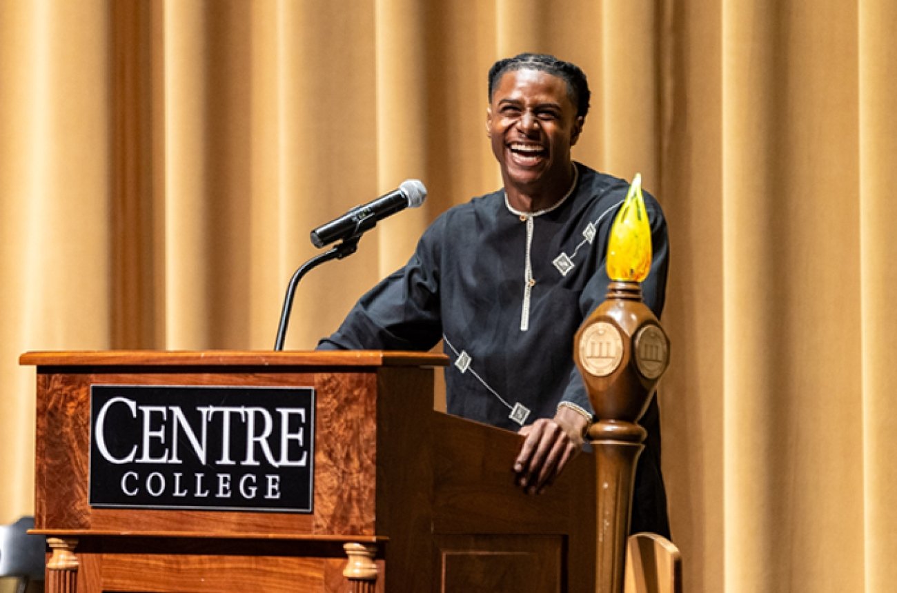 Student standing at podium during Honors Convocation