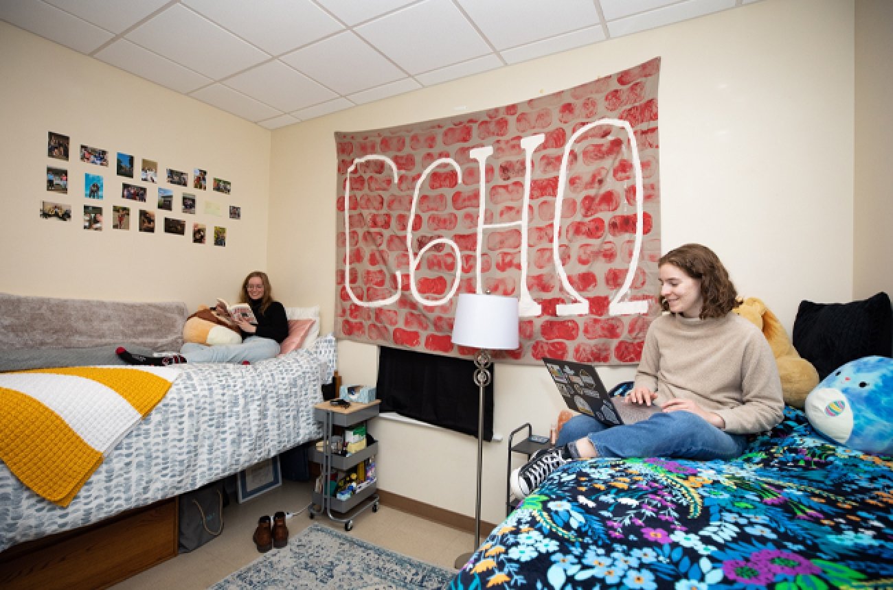 Two students sitting in dorm room