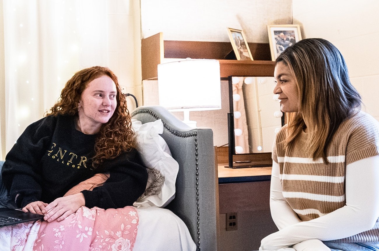 Students talking in residence hall room