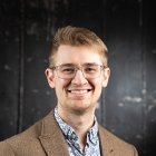 Person wearing glasses smiling