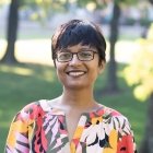 Person wearing glasses smiling