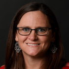 Person wearing glasses smiling