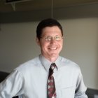 Person wearing glasses smiling