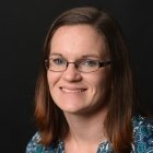 Person wearing glasses smiling