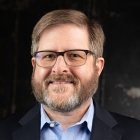 Person wearing glasses smiling