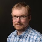 Person wearing glasses smiling