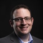 Person wearing glasses smiling