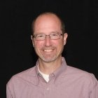 Person wearing glasses smiling