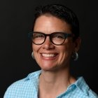 Person wearing glasses and smiling