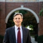 Robert Schalkoff headshot -person wearing glasses and wearing dark sports jacket with light blue shirt and maroon tie