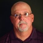 Person wearing glasses and smiling