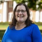 Person wearing glasses and smiling