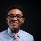 Person wearing glasses smiling