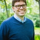 Person wearing glasses and smiling