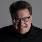 Person wearing glasses smiling