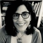 Person wearing glasses smiling