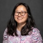 Person wearing glasses and smiling