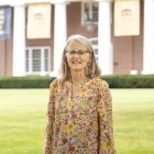 person smiling while standing in front of Old Centre