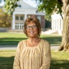 Person wearing glasses and smiling