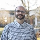 Person wearing glasses and smiling