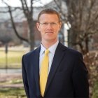 Person wearing glasses and smiling