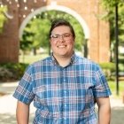 Person wearing glasses and smiling