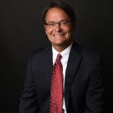 Person wearing glasses smiling