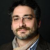 Person wearing glasses smiling
