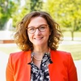 Person wearing glasses smiling