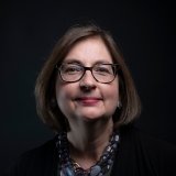 Person wearing glasses smiling