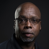 Person wearing glasses and smiling