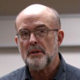 Person wearing glasses smiling