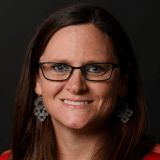 Person wearing glasses smiling