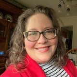 Person wearing glasses smiling