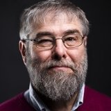 Person wearing glasses smiling