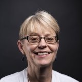 Person wearing glasses smiling