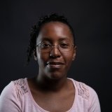 Person wearing glasses smiling