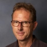 Person wearing glasses smiling