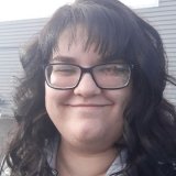 Person wearing glasses and smiling