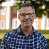 Person wearing glasses and smiling