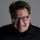 Person wearing glasses smiling