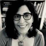 Person wearing glasses smiling