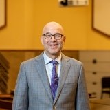 Person wearing glasses smiling