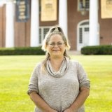 Person wearing glasses and smiling