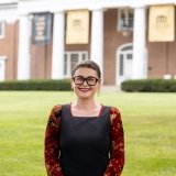 Person wearing glasses smiling